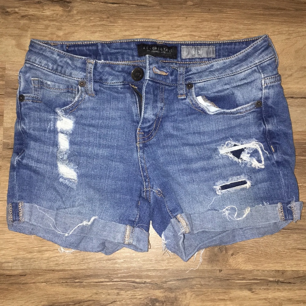 Dark denim midi shorts with holes